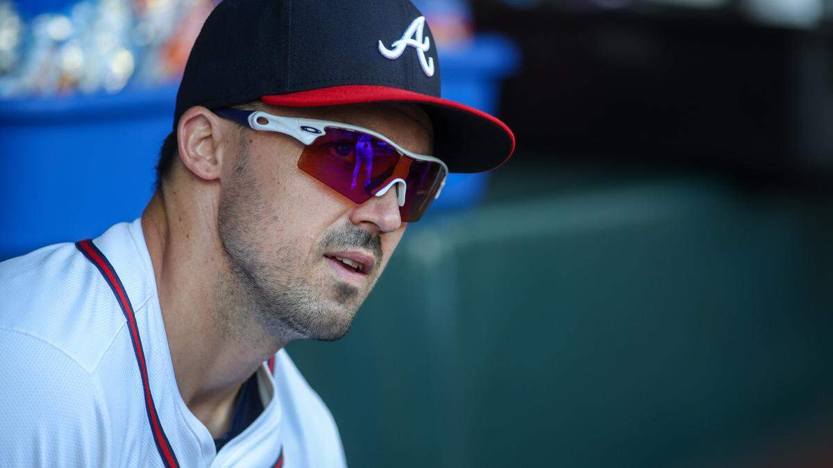 Atlanta Braves right fielder Adam Duvall (14) in the dugout before a game against the Milwaukee Brewers at Truist Park during the 2024 season.