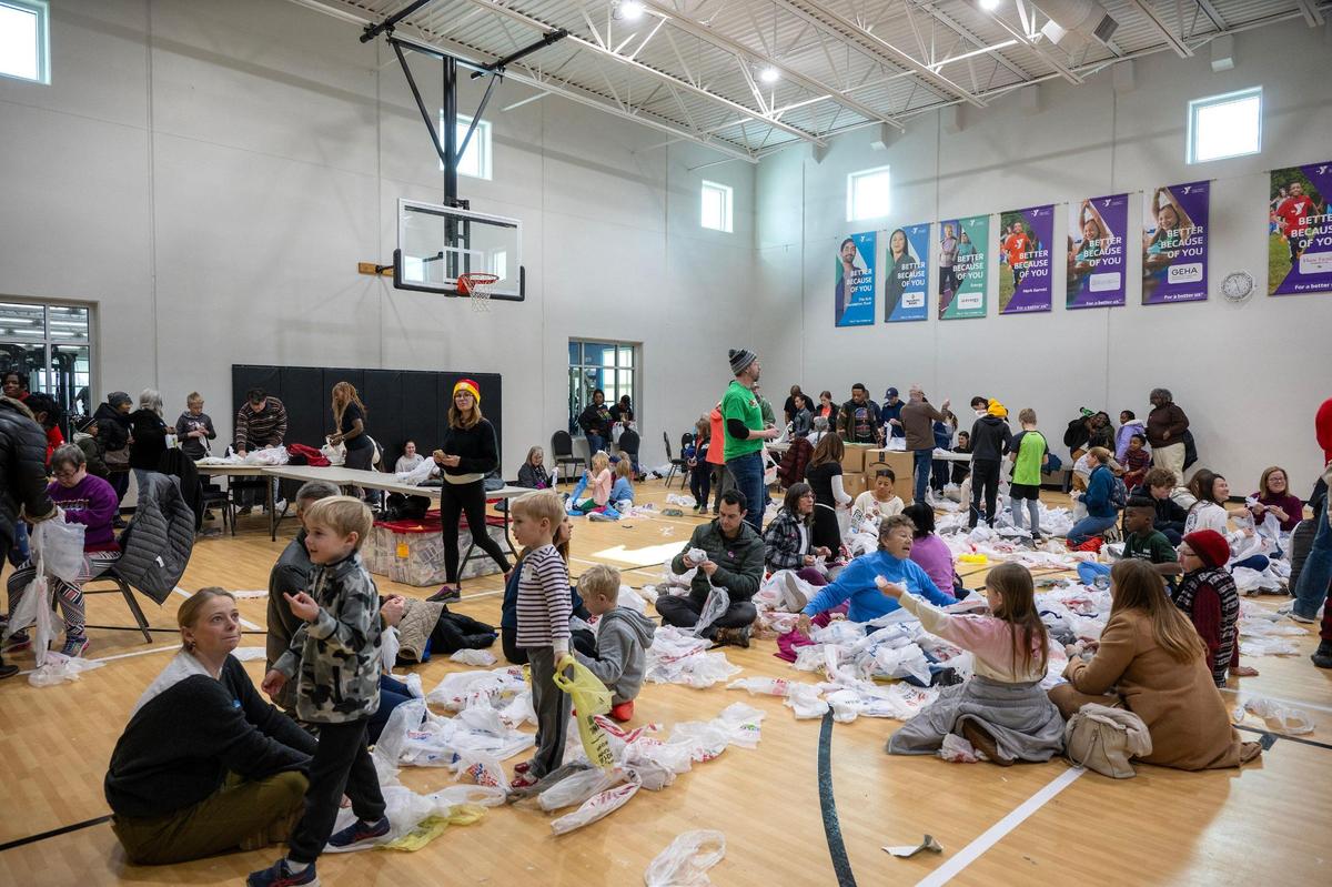 Volunteers filled the gymnasium tying plastic bags together to create to plarn mats, sleeping mats made from plastic bags that are crocheted together, during the he YMCA MLK Day of Service on Monday, Jan. 20, 2025, at the Cleaver Family YMCA in Kansas City. The mats will be donated to the unhoused or those in need.