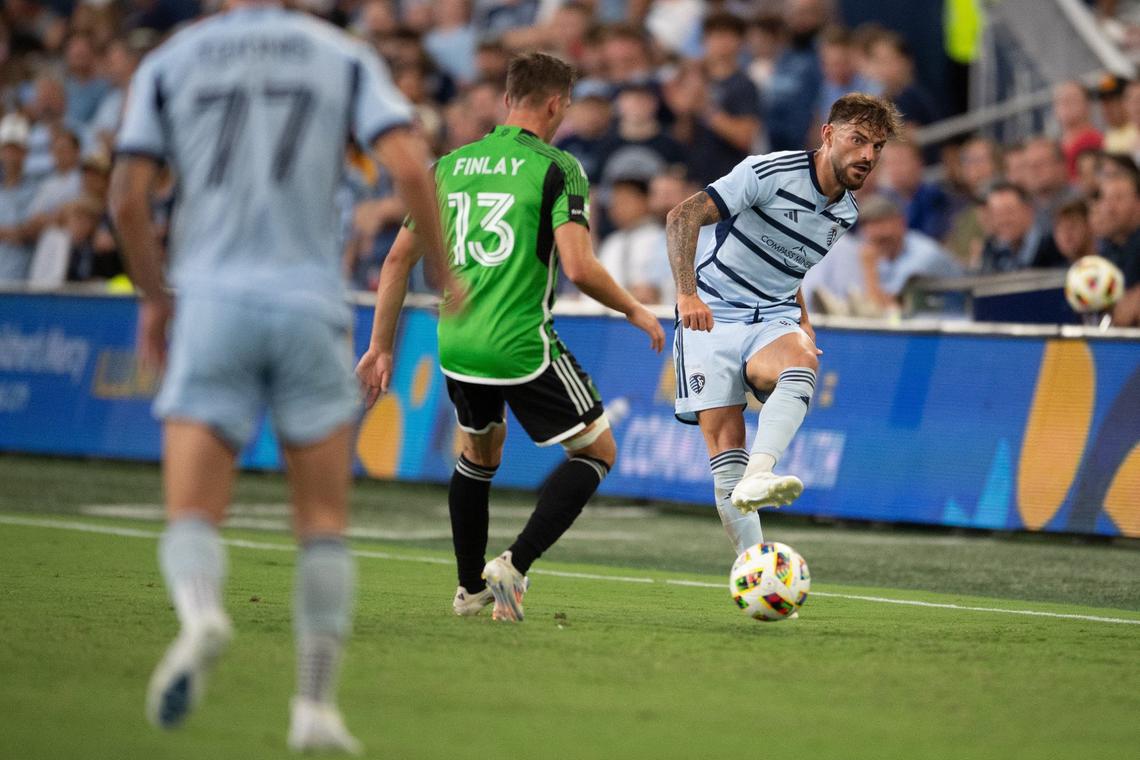 Sporting KC defender Tim Leibold passes the ball to forward Marinos Tzionis during a match against Austin FC on Saturday, June 29, 2024, at Children’s Mercy Park in Kansas City, Kansas. Sporting KC defeated Austin FC 2-0.