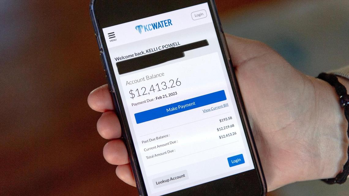 Kelly Powell shows a screenshot of a KC Water bill that totaled more than $12,000 due to a faulty meter at her home on Friday, Feb. 3, 2023, in Kansas City.
