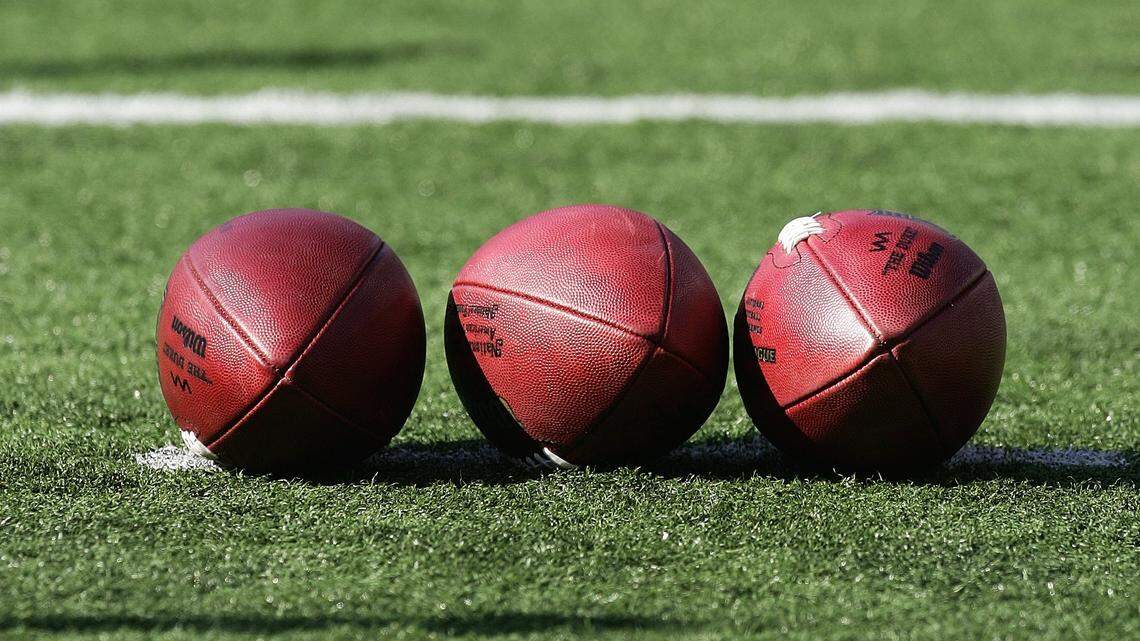 FILE PHOTO: Three footballs lay on the field at M&T Bank Stadium on November 5, 2006 in Baltimore, Maryland.