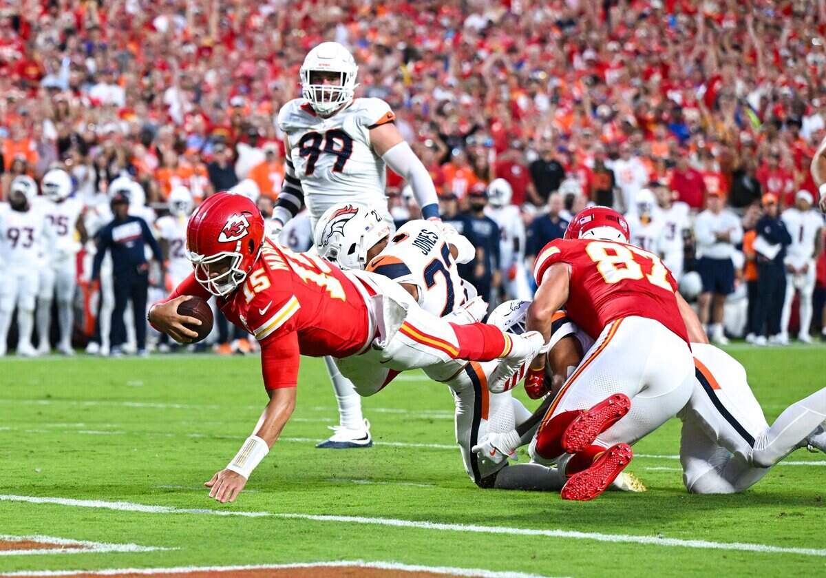 Kansas City Chiefs quarterback Patrick Mahomes (15) dives to score a touchdown in the Kansas City Chiefs vs. Denver Broncos NFL season opener at Arrowhead Stadium in Kansas City on Sept. 14, 2026.