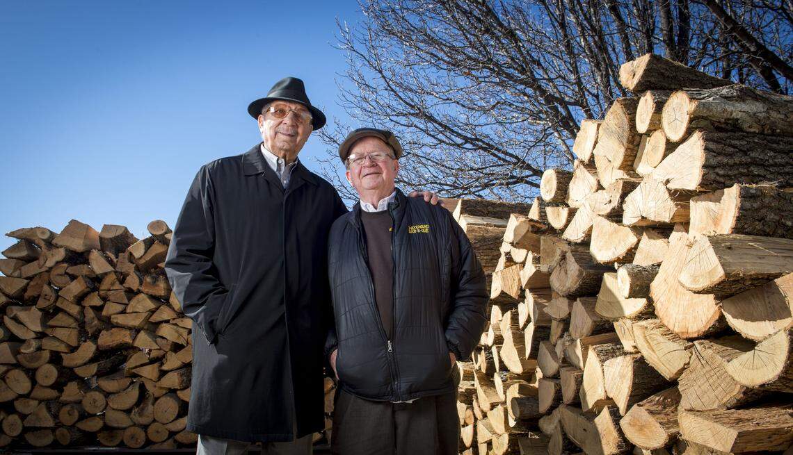 Frank Schloegel, owner of Southside Wood Co. and Woodyard Bbq, and Ollie Gates, of Gates BBQ, stood near a wood pile outside of the 47th Street and Paseo Boulevard restaurant location in 2017. Schloegel was the main provider of wood for Gates and Gates & Sons for over 50 years.