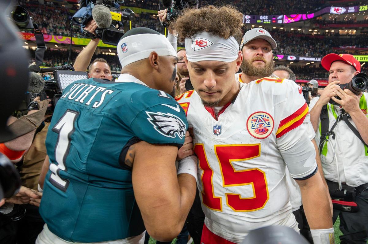 Philadelphia Eagles quarterback Jalen Hurts (1) and Kansas City Chiefs quarterback Patrick Mahomes (15) meet on the field after the Eagles’ 40-22 victory over the Chiefs in Super Bowl LIX on Sunday, Feb. 9, 2025, in New Orleans.
