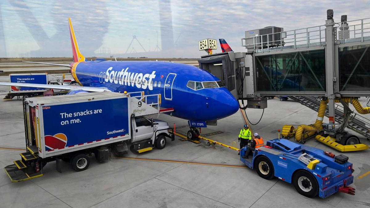 Ground crews greeted a Southwest Airlines jet, the first flight to land at the new $1.5 billion single terminal on Tuesday, Feb. 28, 2022, at Kansas City International Airport.