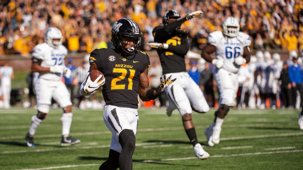 Missouri defensive back Christian Holmes returned an interception for a touchdown during the first half against Memphis on Saturday in Columbia.