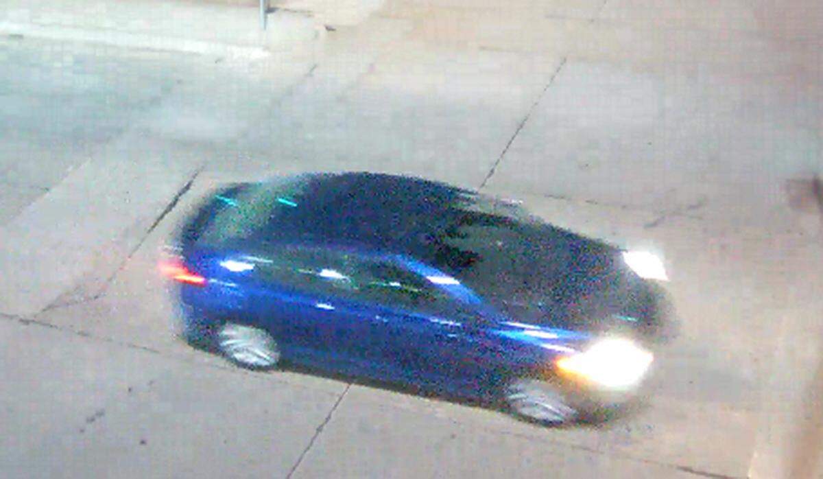 The ATF released this image of a blue car that it said was used as a getaway vehicle after a burglary at an Overland Park pawn shop in which nearly 30 guns were stolen Sunday morning.