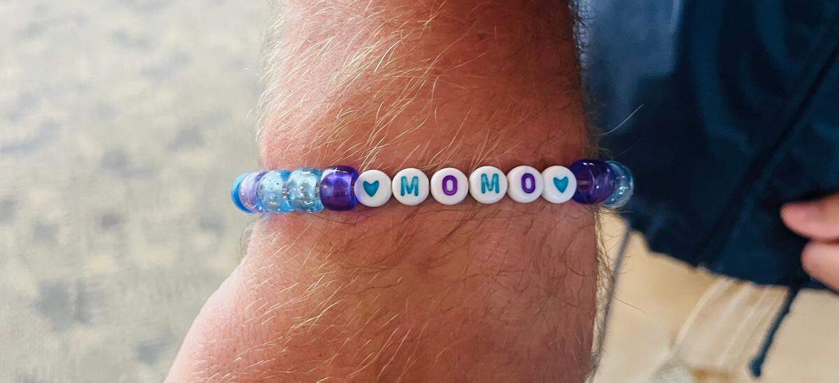 Jorge Rivera, a team lead at the Kansas City Zoo, wears a bracelet in remembrance of Mahali. Samantha Latson