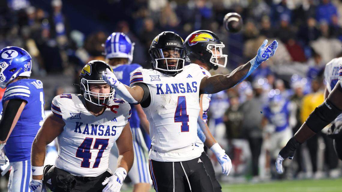 Kansas Jayhawks running back Devin Neal (4) celebrates a touchdown against the BYU Cougars during the first quarter at LaVell Edwards Stadium on Nov. 16, 2024.