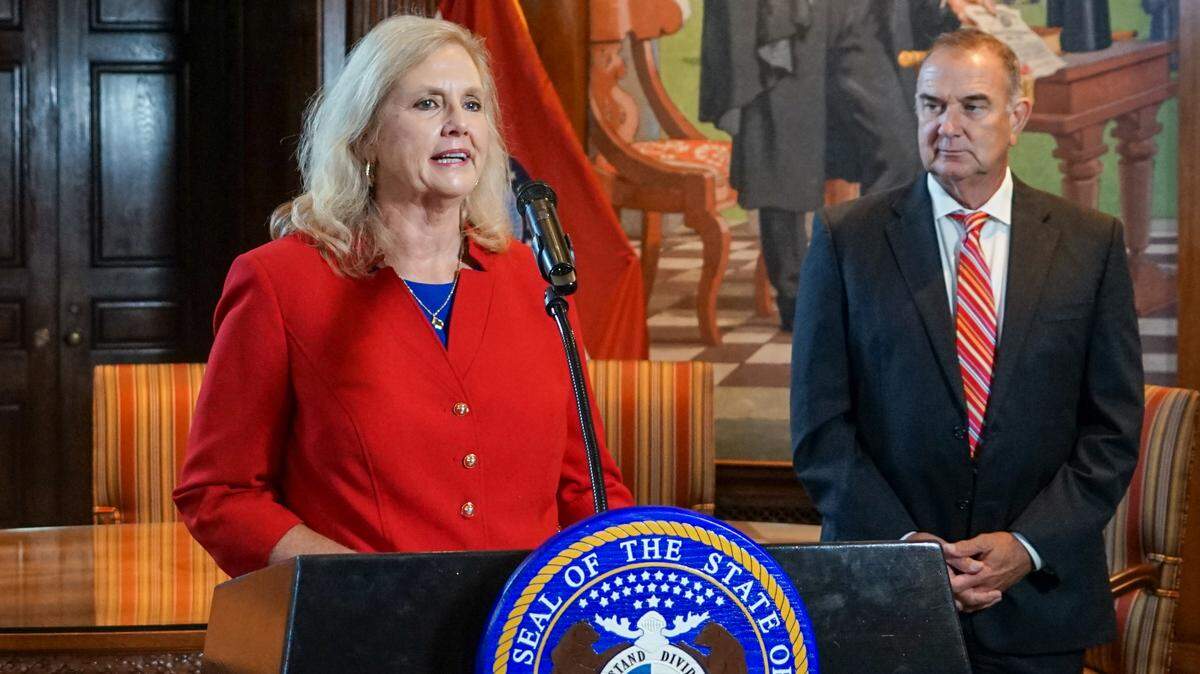 Missouri Gov. Mike Kehoe, right, picked Catherine Hanaway, left, as the state’s next attorney general. Hanaway spoke with reporters at the state Capitol on Tuesday, Aug. 19, 2025.
