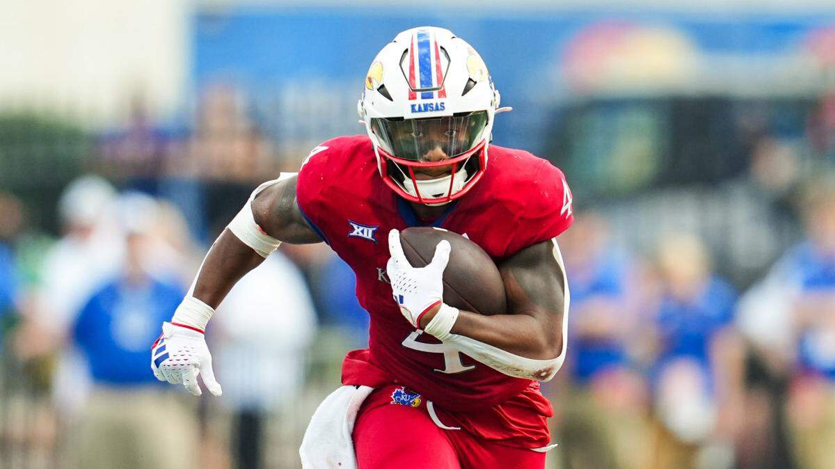 Running back Devin Neal and the Kansas Jayhawks take on UNLV in the Guaranteed Rate Bowl on Tuesday in Phoenix.