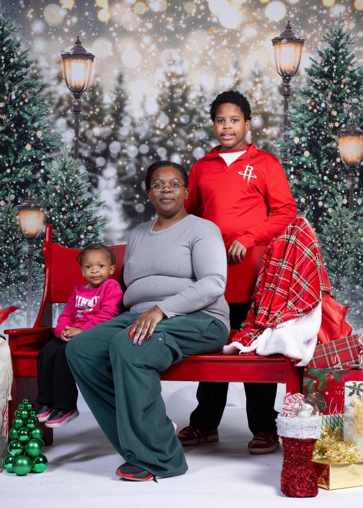 Ilynn Howard, left, Lezlie Collins, center, Ja’Vian Collins at the Soul of Santa breakfast.