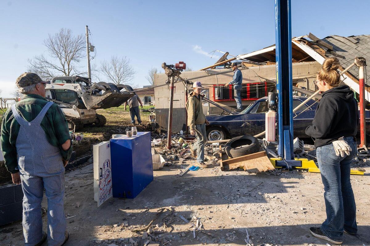 After the Moundville Service Station was destroyed by a tornado, volunteers, family and friends showed up to help clear debris and salvage what they could.