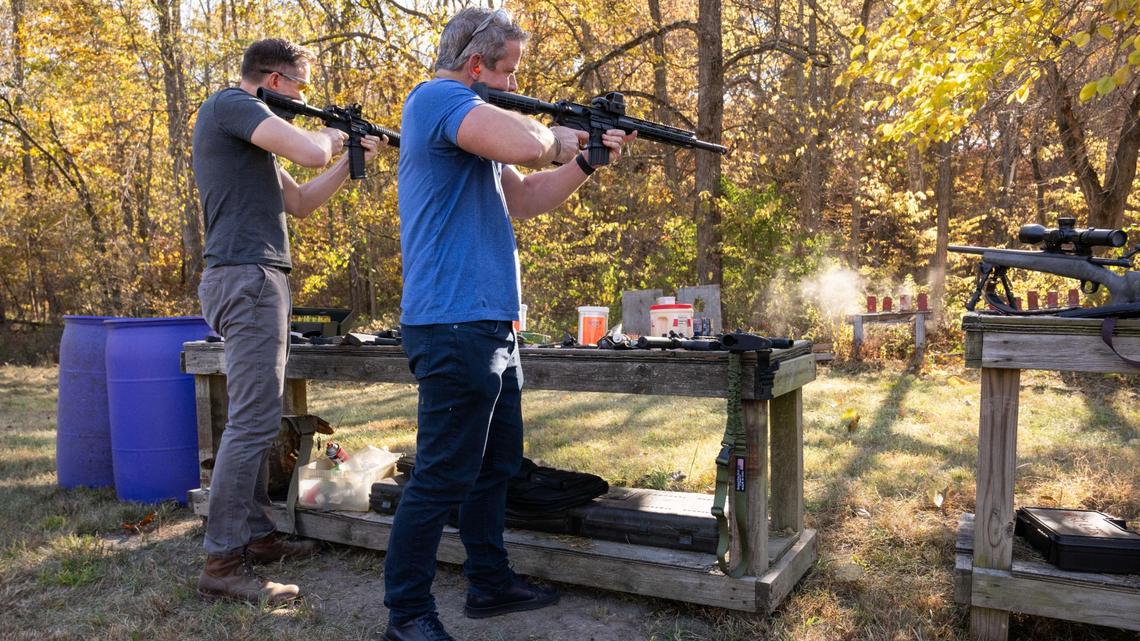 Democratic candidate for U.S. Senate Lucas Kunce and former Republican state representative Adam Kinzinger fire AR-15s during a sport shooting campaign event Tuesday, Oct. 22, 2024 in Holt, Missouri.
