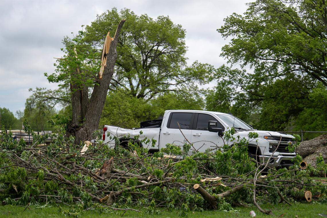 Tree debris littered the yard as cleanup efforts were underway in the 600 block of East Bodine St., in Clinton Missouri, on Thursday, April 16, 2026, after a tornado touched down in Henry County late Wednesday afternoon.