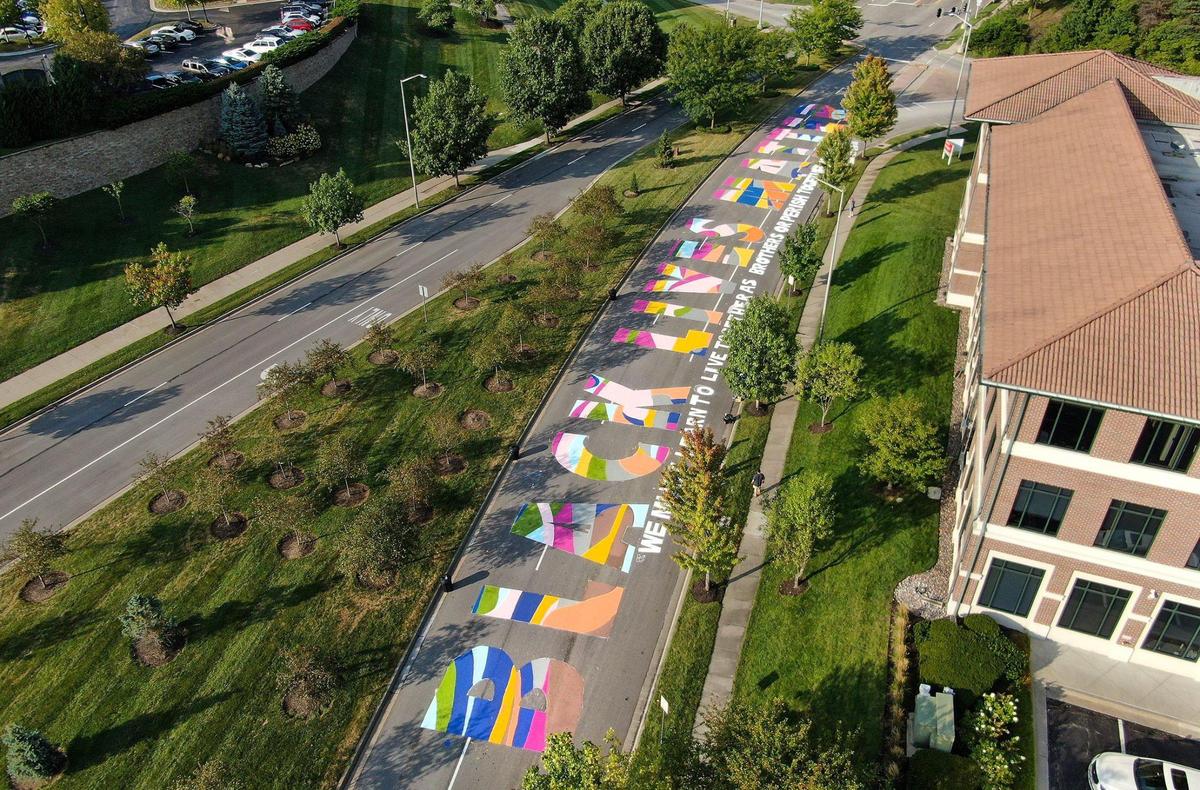 Volunteers painted one of six Black Lives Matter murals at Northwest Briarcliff Parkway and North Mulberry Drive Saturday, Sept. 5, 2020.