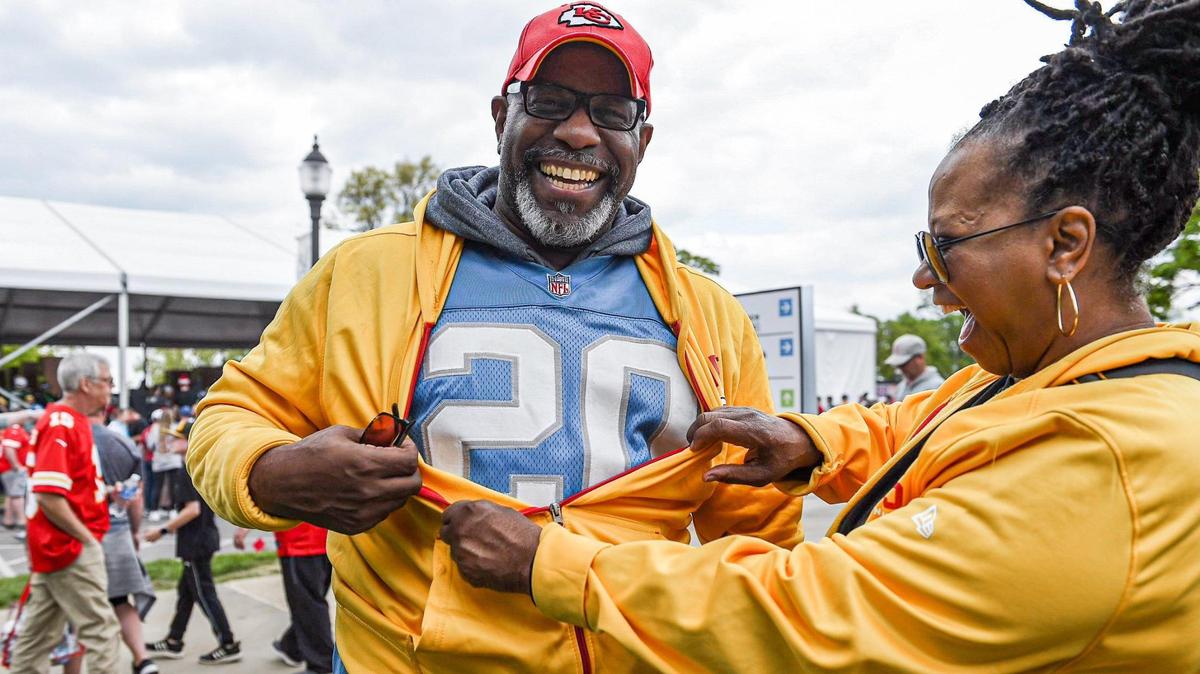 Shyree Leverett exposes the Detroit Lions jersey her husband Tony Leverett was wearing to reveal that he is secretly a Lions fan at the NFL Draft Experience Thursday, April 27, 2023, at the National WWI Museum and Memorial in Kansas City.
