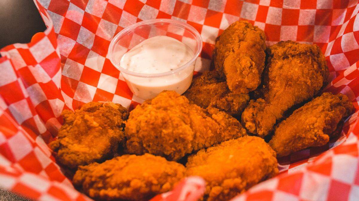File photo of chicken wings. Two people in Missouri fraudulently obtained PPP loans, then used the money to pay contractors to build out a wings restaurant, authorities said.