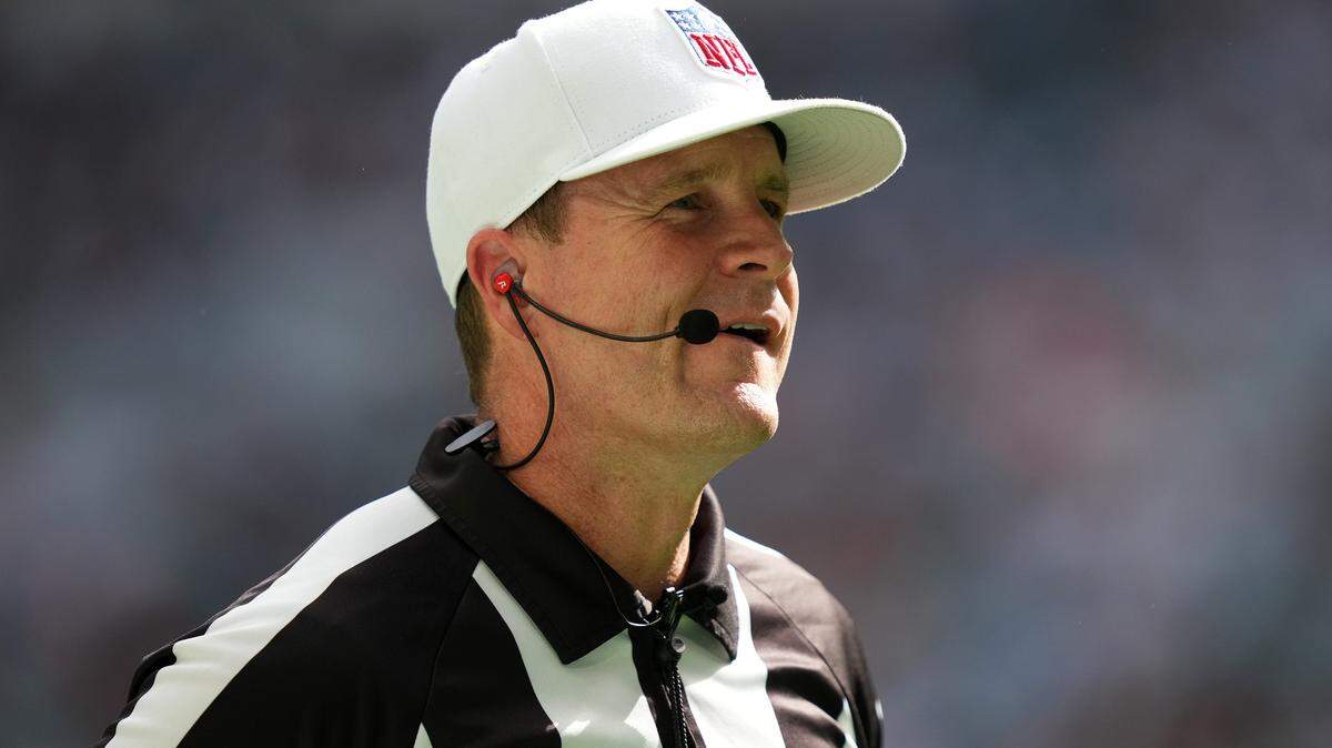 NFL referee Shawn Hochuli (83) stands on the field during the first half between the Miami Dolphins and Cleveland Browns at Hard Rock Stadium.