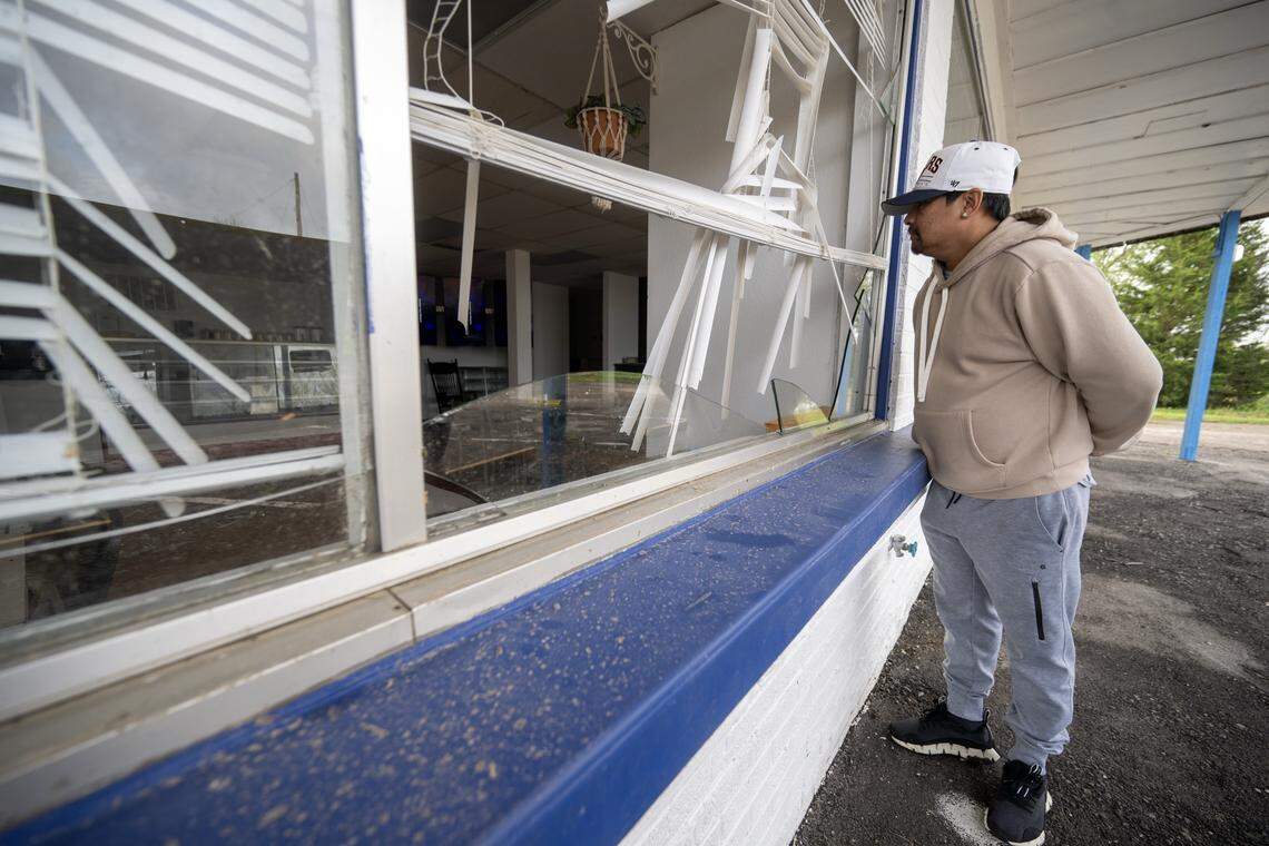Vouchheng Leang looked over damage at Daylight Donuts, his place of employment, on Tuesday, April 14, 2026, in Ottawa, Kansas, after a tornado moved through the town Monday night.