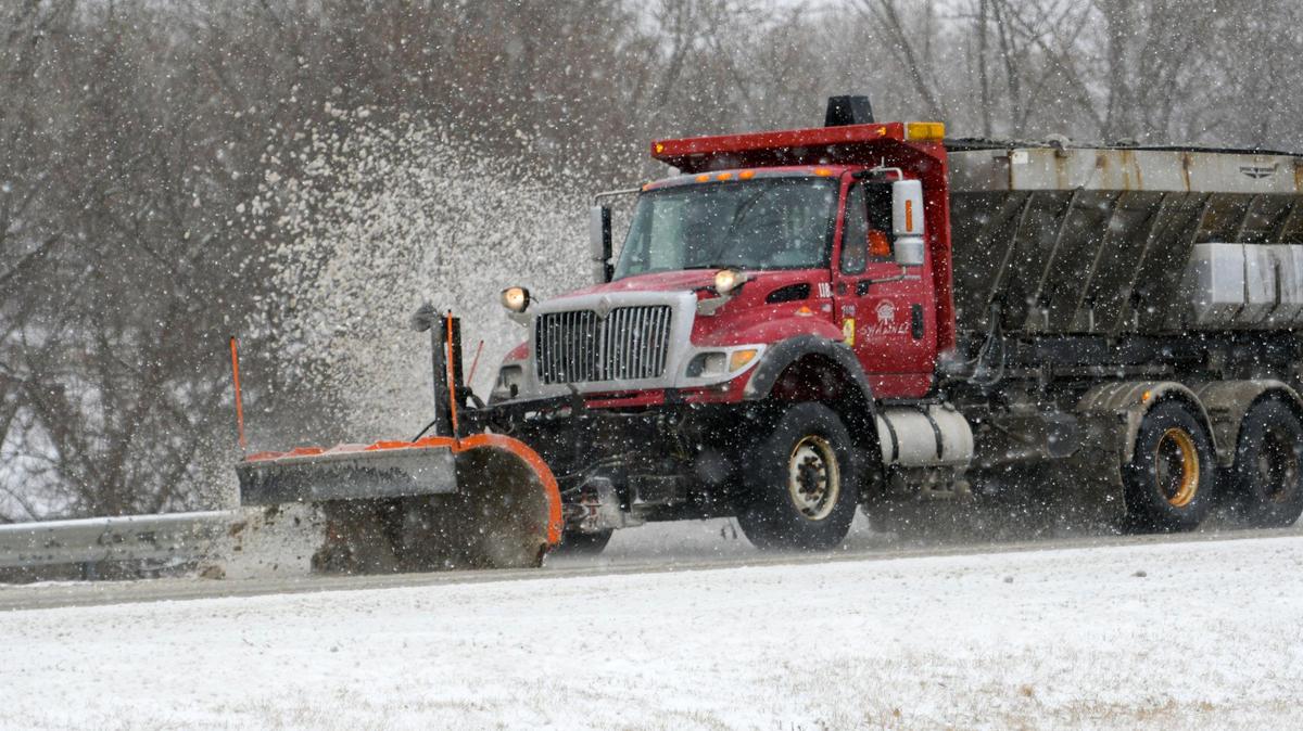 A light snow fell as a snowplow cleared the road along Shawnee Mission Parkway on Thursday, March 10, 2022, in Shawnee.