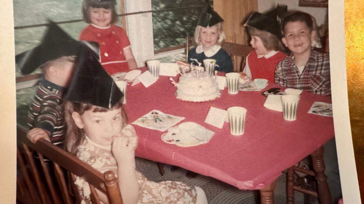 Sherry Kuehl, at the head of the table celebrating her birthday in 1967, is a proud member of the baby boom generation.