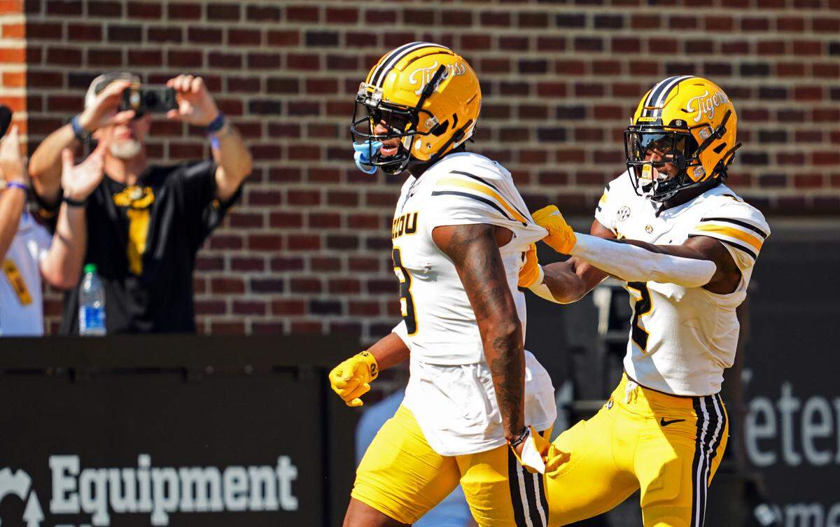 Former Missouri Tigers receiver Chance Luper, right, celebrates Luther Burden III’s punt-return TD during a game against Abilene Christian at Memorial Stadium.