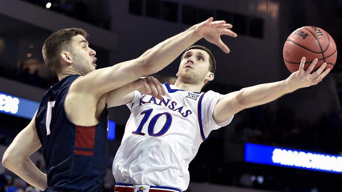 Svi Mykhailiuk (right) is trying to take his basketball wares from KU to the NBA.