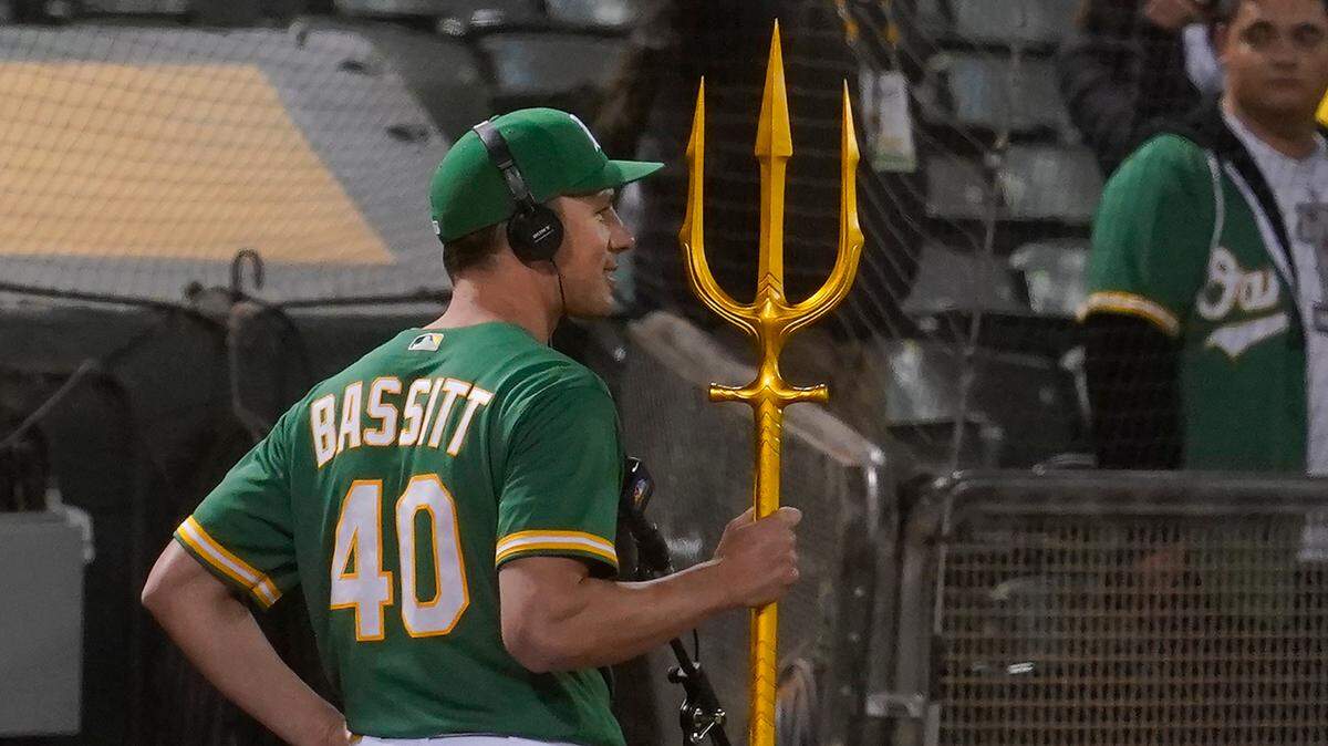 Oakland Athletics pitcher Chris Bassitt holds a trident while interviewed after the Athletics defeated the Los Angeles Angels in a baseball game in Oakland, Calif., Thursday, May 27, 2021. (AP Photo/Jeff Chiu)