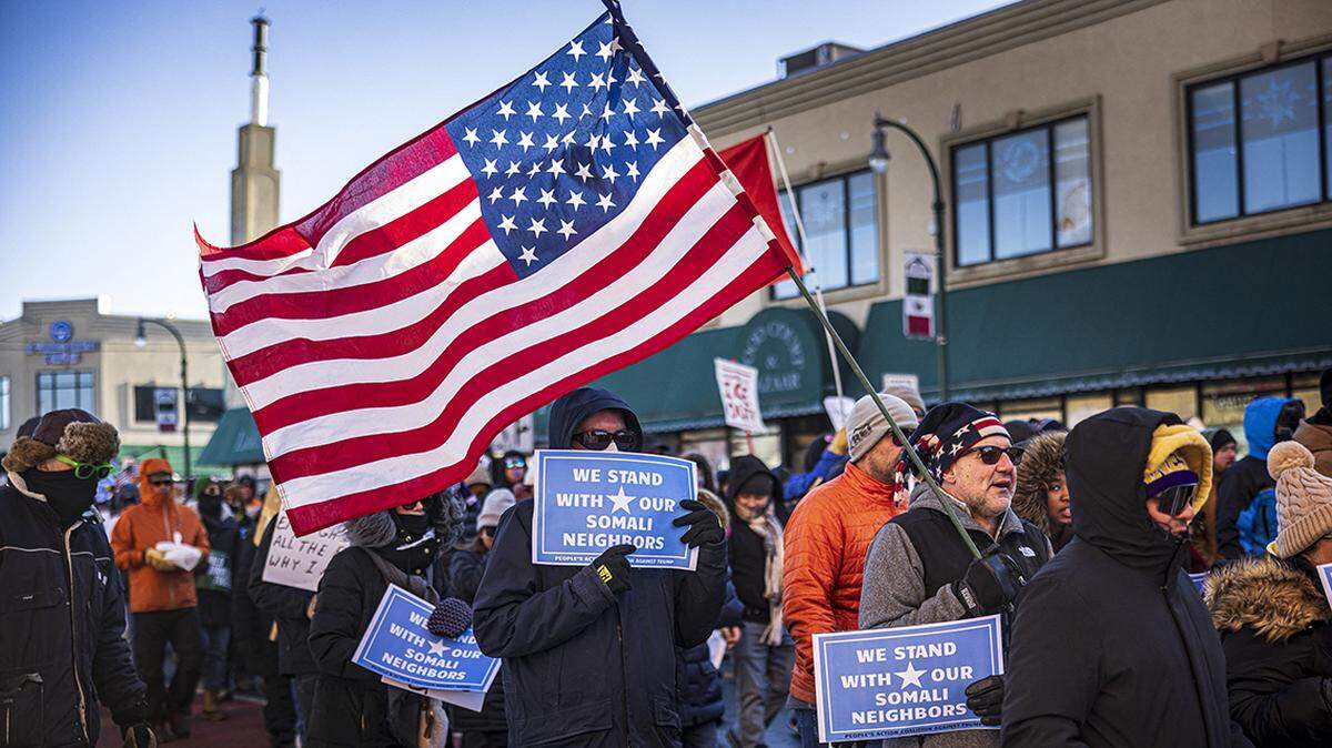 Protesters march through frigid conditions in Minneapolis in support of Somali, Latino and Hispanic immigrants.