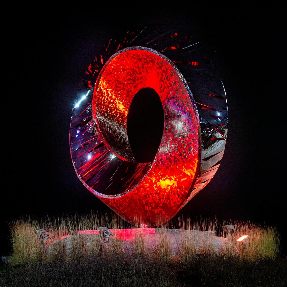A sculpture at the City Place office park in Overland Park was lit to alternate between red and gold.