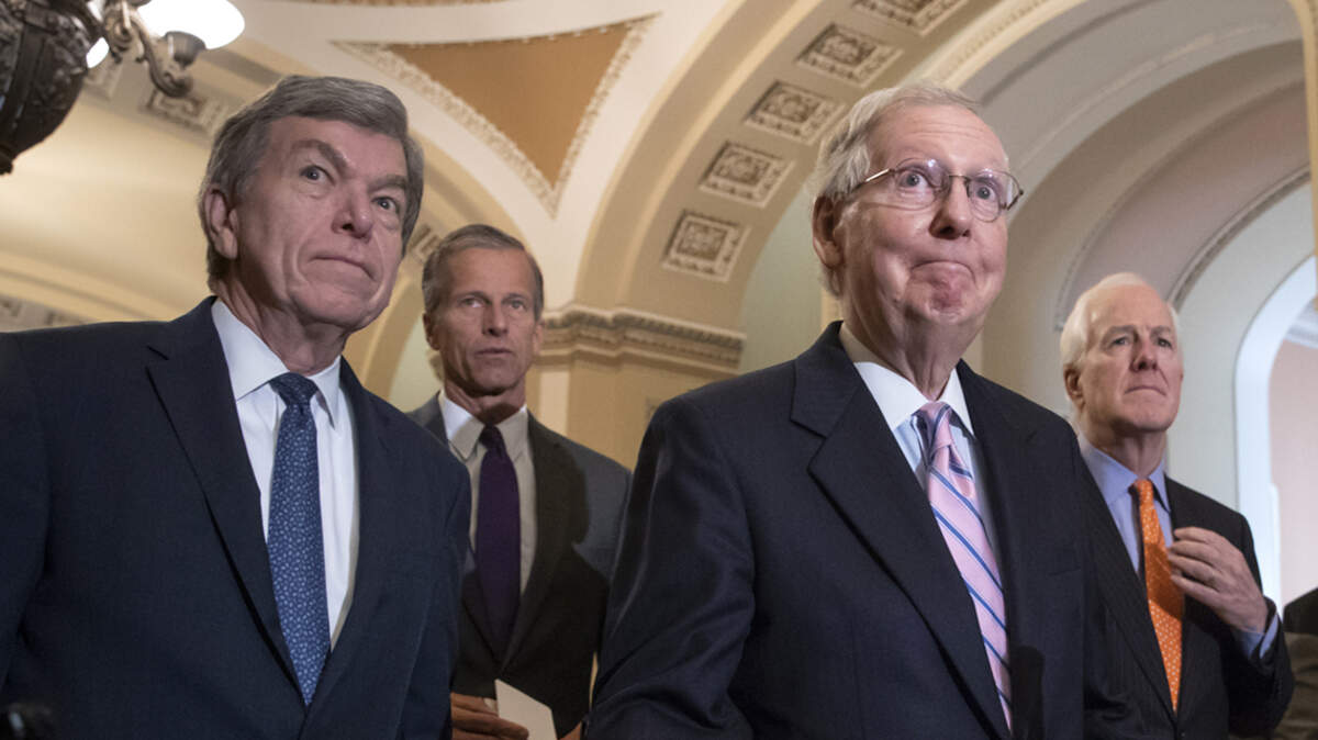 Senate Majority Leader Mitch McConnell, joined from left by Sens. Roy Blunt, John Thune and Majority Whip John Cornyn, speaks with reporters last September.