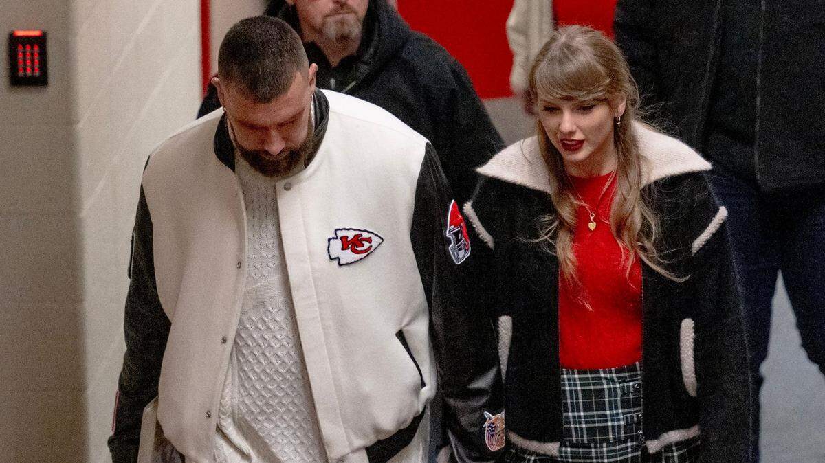 Pop star Taylor Swift holds hands with boyfriend and Kansas City Chiefs tight end Travis Kelce as they leave Arrowhead Stadium after an NFL football game on Monday, Dec. 25, 2023, in Kansas City.