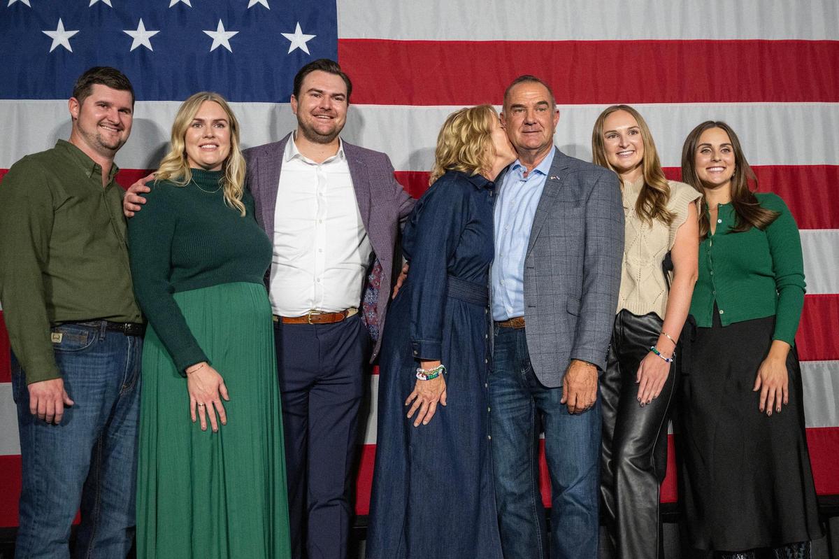 Mike Kehoe, center, poses for photos with his family after addressing supporters at a watch party hosted by Capital Bluffs Event Center, following his victory in the governor’s race against Crystal Quade on Tuesday, Nov. 5, 2024, in Jefferson City.