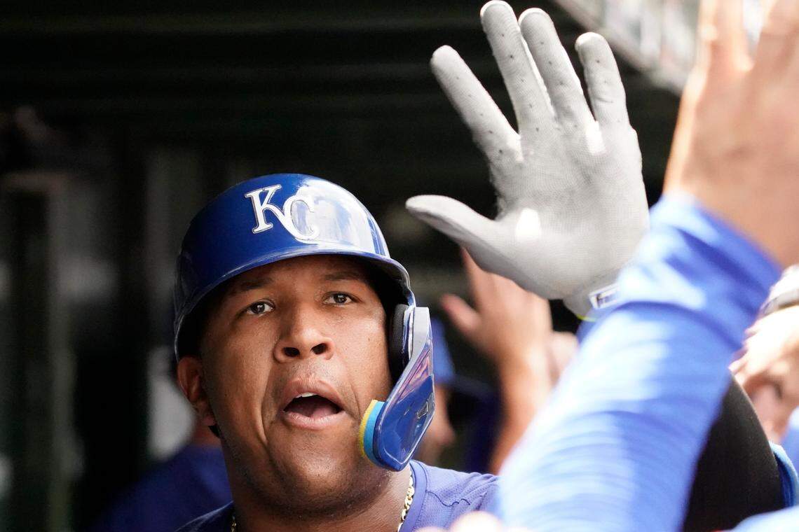 Kansas City Royals designated hitter Salvador Perez was greeted by teammates after hitting a two-run home run against the Chicago Cubs during the third inning at Wrigley Field.