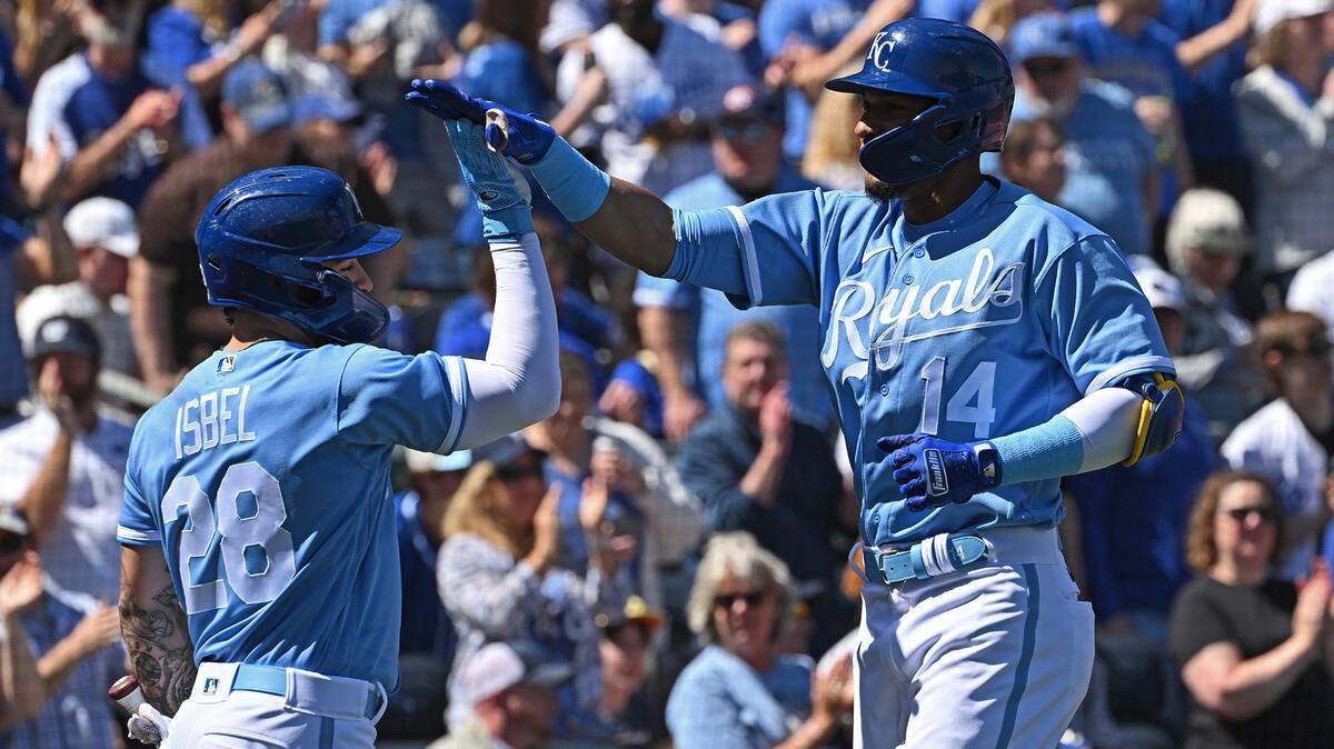 Apr 2, 2023; Kansas City, Missouri, USA; Kansas City Royals left fielder Edward Olivares (14) celebrates with center fielder Kyle Isbel (28) after hitting a solo home run during the second inning against the Minnesota Twins at Kauffman Stadium. Mandatory Credit: Peter Aiken-USA TODAY Sports