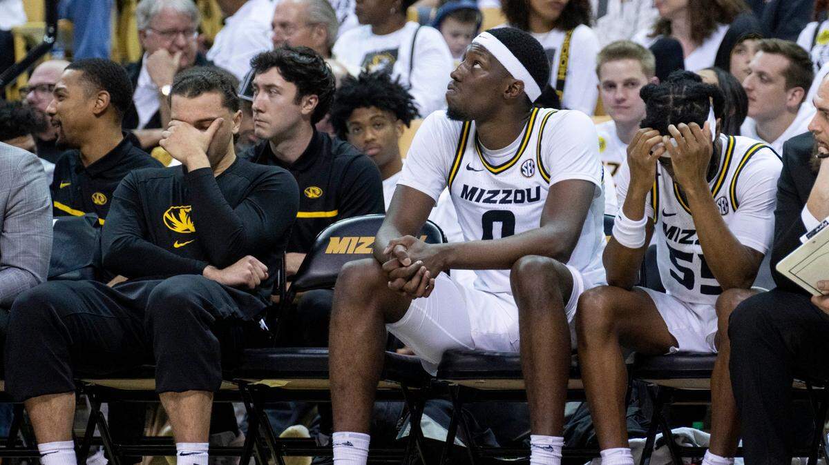 Missouri’s Tre Gomillion, left, Mohamed Diarra, center, and Sean East II, right, sit on the bench late in the second half of a loss to Texas A&M on Saturday, Feb. 18, 2023.