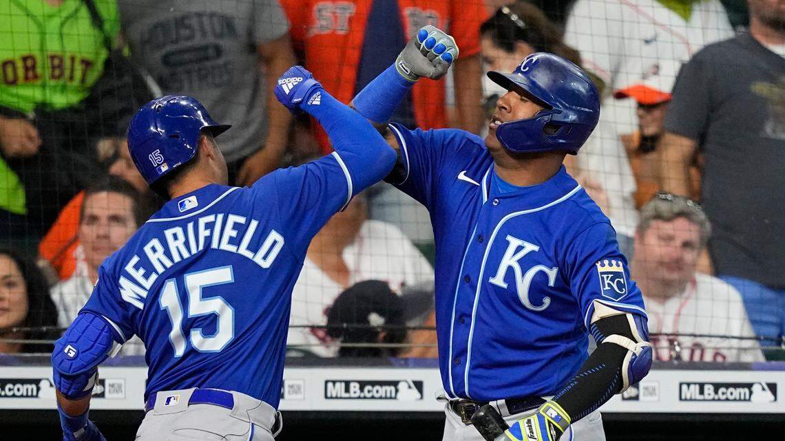 Kansas City Royals’ Whit Merrifield (15) celebrates with Salvador Perez after hitting a grand slam against the Houston Astros during the seventh inning of a baseball game Wednesday, Aug. 25, 2021, in Houston. (AP Photo/David J. Phillip)