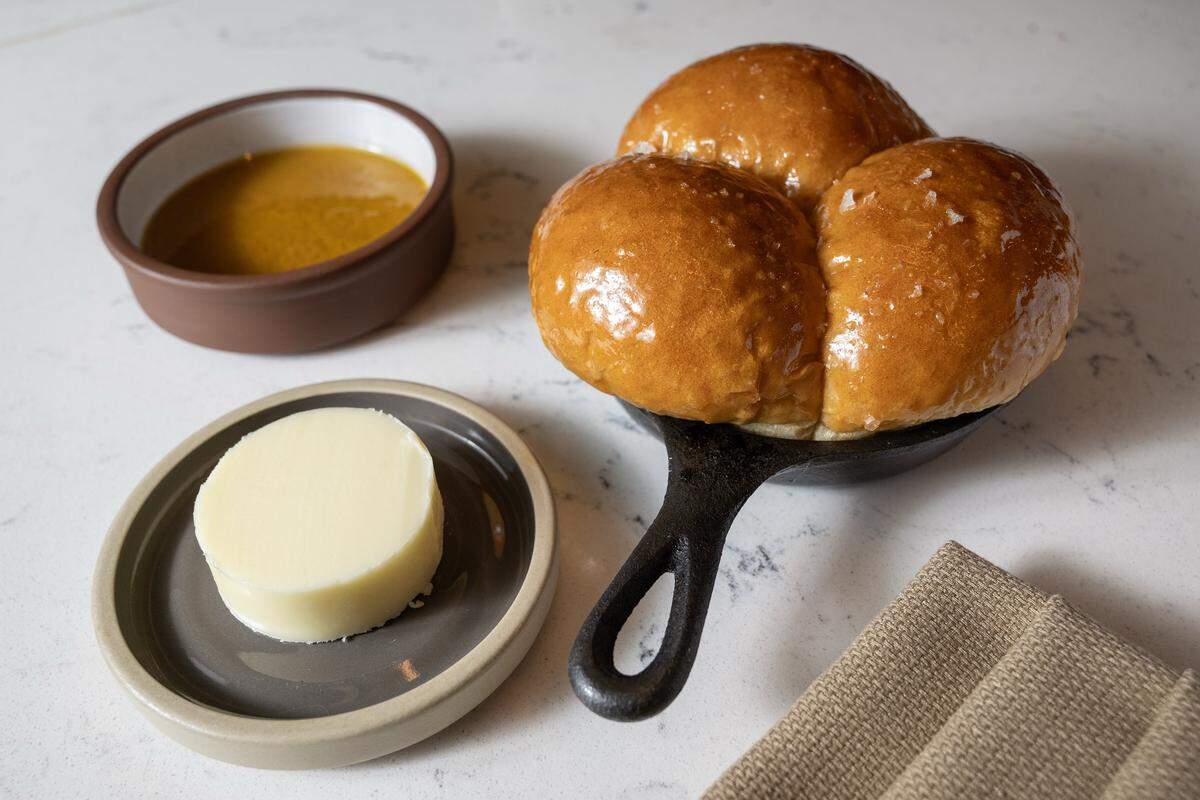 Executive Chef Johnny Leach of The Town Company makes Hot Buns with house cultured butter and carrot dip The item is a staple on the menu for the James Beard nominated chef. 
