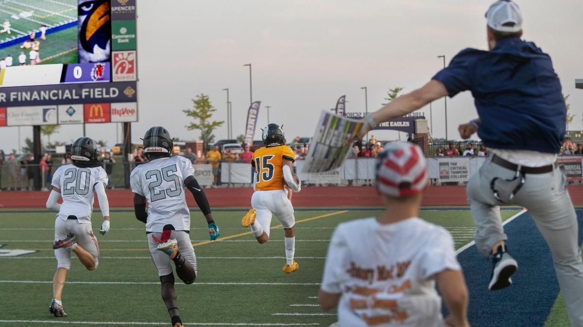 Liberty North’s Keelan Smith carried the ball for the Eagles 2nd touchdown in the first half of the game against Lee’s Summit North Friday, August 26, 2022.
