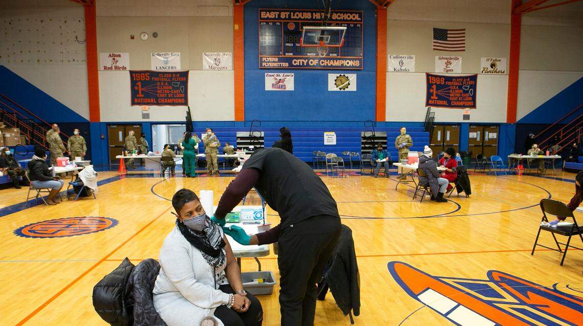 Missouri is virtually surrounded by states that are vaccinating teachers. In Illinois, Chantel Crawford, a first grade teacher at Dunbar Elementary School, was in the first round of East St. Louis educators to get the shot Feb. 9, 2021.