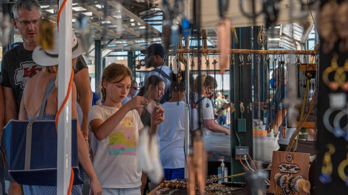 Shoppers looked through hand-made jewelry at Art Garden KC in City Market last summer. Art Garden KC is one place you can check out for Mother’s Day activities Sunday.