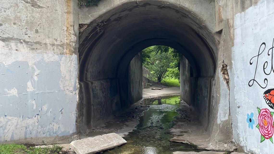 Water from the Jersey Creek watershed flows downstream through a public park on the afternoon of June 30, 2025. The Unified Government of Wyandotte County must separate storm and sewer lines within the watershed by 2032 as part of a 2020 agreement with the U.S. Environmental Protection Agency.  