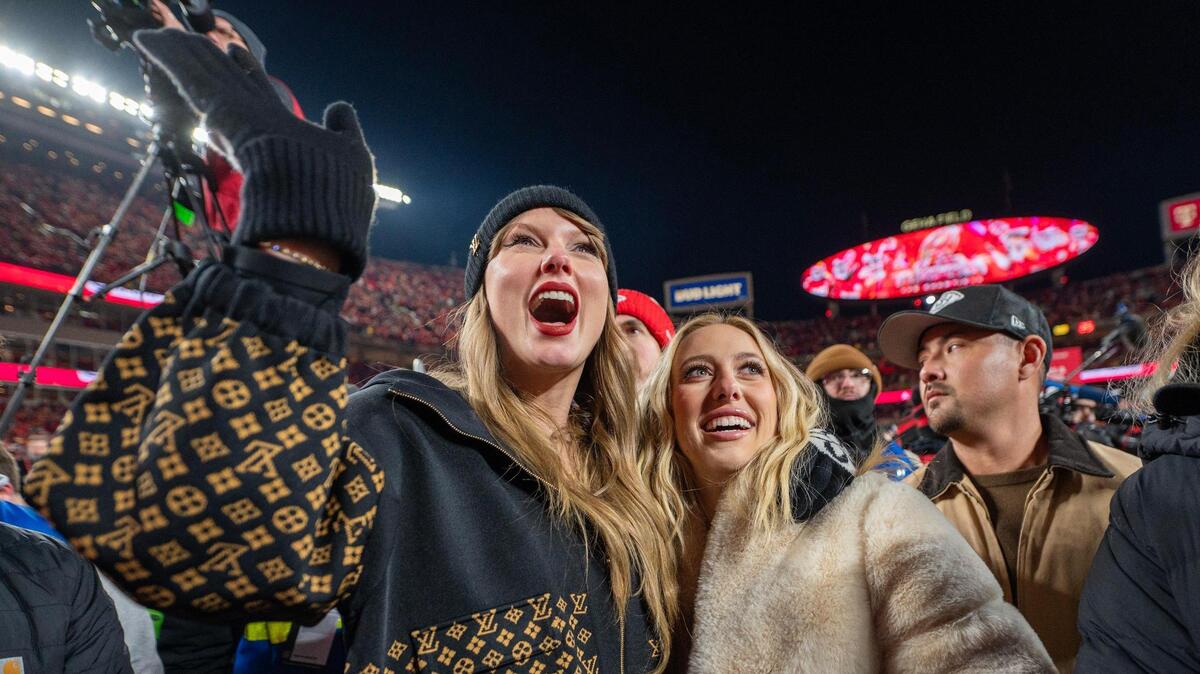 Taylor Swift, left, cheers with Brittany Mahomes, at the trophy ceremony following the Chiefs’ 32-29 victory over the Buffalo Bills in the AFC Championship Game on Sunday. Ahead of the Super Bowl, Sports Illustrated Swimsuit Issue has reviewed Mahomes’ best game-day fits of the season.