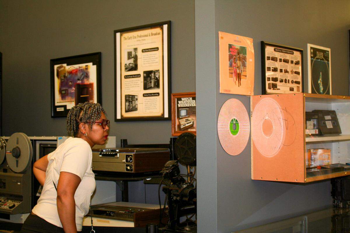 A guest of the Media Tech Museum looks at the broadcast section of the museum on the day of its opening, June 1.