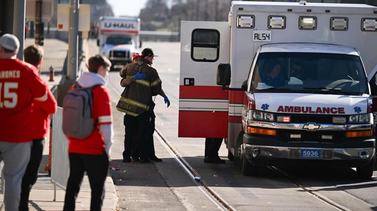 A firefighter waits outside an ambulance near Union Station after several were people were shot near a rally there during the Kansas City Chiefs Super Bowl LVIII victory parade Wednesday, 2024, in Kansas City.