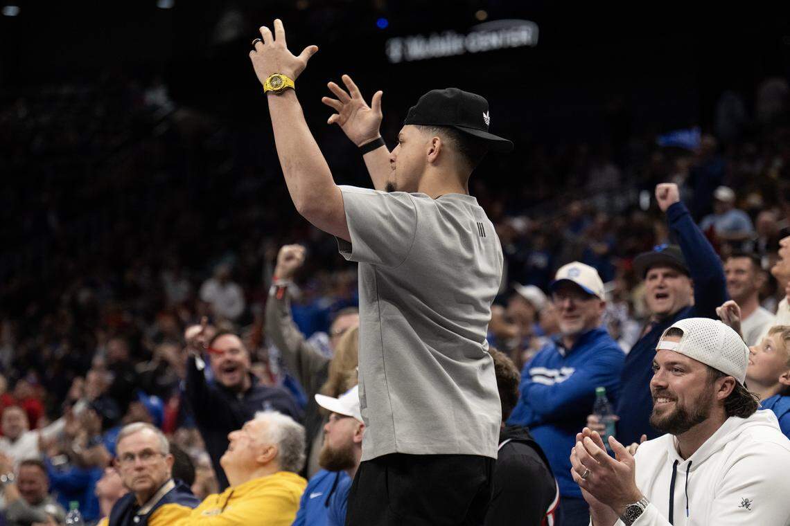 Chiefs quarterback Patrick Mahomes and Blake Bell former Chiefs acknowledged the crowd during the BYU-West Virginia game during the first half of the Big 12 Men's Basketball Tournament at T-Mobile Center on Wednesday, March 11, 2026, in Kansas City.
