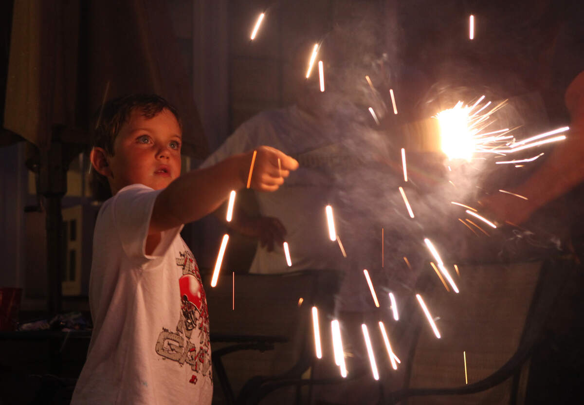 Nate Murray, 4, holds a sparkler at a home in Scarborough, Maine, Wednesday, July 4, 2012. Sparklers, hot enough to burn some metals, are the No. 1 cause of fireworks-related injuries, warns the Consumer Product Safety Commission. In recent years some cities have banned sparklers on the Fourth of July..