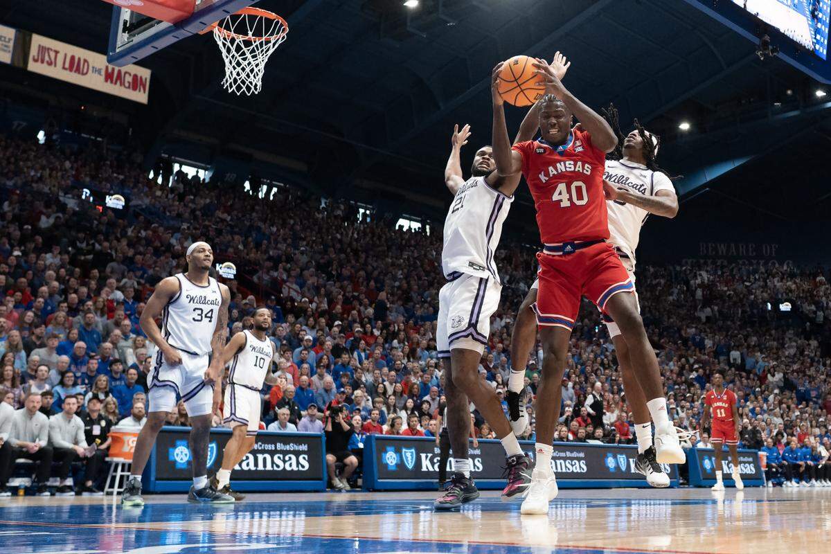Kansas Jayhawks forward Flory Bidunga (40) pulls down a rebound in the first half against the Kansas State Wildcats at Allen Fieldhouse on Saturday, March 7, 2026, in Lawrence, Kansas.