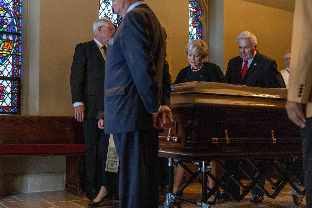 Len Dawson’s wife, Linda walks alongside her husband’s casket through the back of the sanctuary at Country Club Christian Church after a memorial service on Friday, Sep. 16, 2022, in Kansas City.